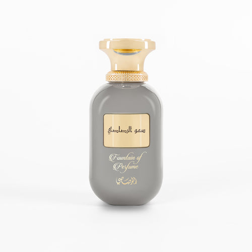 Gray perfume bottle with gold cap on a white background