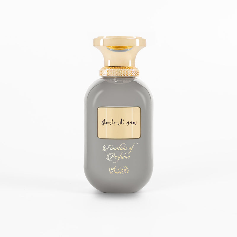 Gray perfume bottle with gold cap on a white background