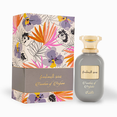 Perfume bottle with floral packaging on a white background