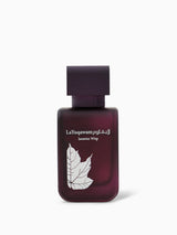 A purple bottle of La Yuqawam Jasmine Wisp perfume with a leaf design and white text.